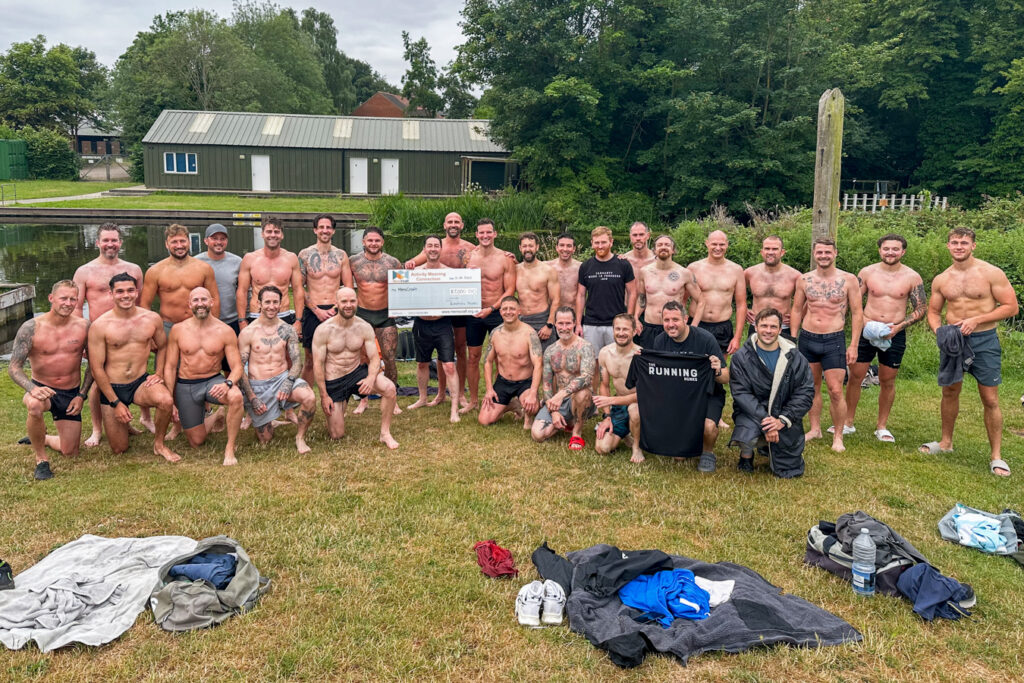 The Running Hunks present their cheque for £8,000 to MensCraft